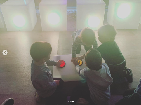 children pressing buttons making lights change
